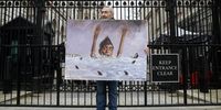 Political satire artist Kaya Mar holds his painting depicting British Prime Minister Rishi Sunak outside 10 Downing Street in London, Britain, 28 February 2024. Sunak is under pressure from members of the Conservative party after suspending former Conservative party deputy chairman Lee Anderson over 'anti-islamic' remarks.  EPA-EFE/ANDY RAIN