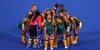 TOKYO, JAPAN - JULY 26: South Africa players huddle during the Women's Preliminary Pool A match between South Africa and Great Britain on day three of the Tokyo 2020 Olympic Games at Oi Hockey Stadium on July 26, 2021 in Tokyo, Japan. (Photo by Francois Nel/Getty Images)