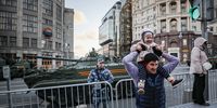 epa09926896 People watch Russian heavy weapons at Tverskaya street during the rehearsal of the Victory Day parade in Moscow, Russia, 04 May 2022. Victory Day is held annually on 09 May and marks the defeat of Nazi Germany in 1945.  EPA-EFE/YURI KOCHETKOV