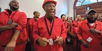 EFF leader Julius Malema dances inside of Cape Town City hall. He was forcibly removed from  proceedings after  his party disrupted the State of the Nation Address, 9 February 2022. (Photo: Shelley Christians)