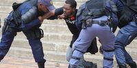 A Wits University student leader, Mcebo Dlamini, is apprehended by police during the #FeesMustFall protests on 4 October 2016 in Johannesburg. (Photo: Gallo Images / Beeld / Felix Dlangamandla)
