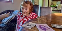 Danuta Miloszewski shares memories in April 2025, when she was 95 and still mobile, under the beady eye of Evie Wonder. (Photo: Wanda Hennig)