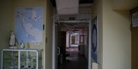 A map flanked by penguins shows West Antarctica, where the Ukraine research station Vernadsky is located. Down the hall, the ceiling has caved in. (Photo: Aleksandr Zakletsky, Yulia Kryvytska)