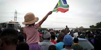 Many supporters who gathered in Langa said the Springboks would help bring the country together. Dozens of flags waved while the crowd sang. (Photo: Noah Tobias)
