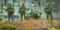 LIVERPOOL, UNITED KINGDOM - MARCH 26:  Life size topiary figures of the Beatles adorn the traffic island at Liverpool's South Parkway rail station on March 26, 2008, in Liverpool, England.  The figures of the famous fab four are made from privet bush and staff at the station have been trained in how to prune them.  (Photo by Christopher Furlong/Getty Images)