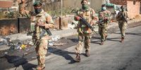 South African National Defence Force soldiers patrol the streets on 15 July 2021 in Alexandra Johannesburg.(Photo by Gallo Images/Sharon Seretlo)