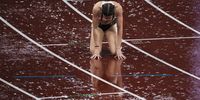 epa09388396 Jessica Turner of Great Britain reacts after competing during heavy rain in the women's 400m hurdles semi final during the Athletics events of the Tokyo 2020 Olympic Games at the Olympic Stadium in Tokyo, Japan, 02 August 2021.  EPA-EFE/PETER KLAUNZER
