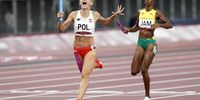 epa09403929 Justyna Swiety-Ersetic of Poland celebrates as she crosses the finish line to win silver in the Women's 4x400m Relay during the Athletics events of the Tokyo 2020 Olympic Games at the Olympic Stadium in Tokyo, Japan, 07 August 2021.  EPA-EFE/FRANCK ROBICHON