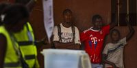 An electoral official shows a ballot during counting of the votes after the closing of a polling station for the Guinea-Bissau's legislative elections at a polling station in Bissau, Guinea-Bissau, 04 June 2023. The polls to choose 102 deputies among 20 parties and two coalitions takes place today, 04 June 2023, following the dissolution of the National People's Assembly (NPA) by the President in May 2022.  EPA-EFE/ANDRE KOSTERS