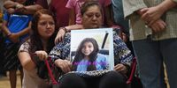 A woman holds a photo of Nevaeh Bravo, who was killed in the mass shooting, during a vigil for the victims of the mass shooting at Robb Elementary School in Uvalde, Texas on May 25, 2022. - The tight-knit Latino community of Uvalde was wracked with grief Wednesday after a teen in body armor marched into the school and killed 19 children and two teachers, in the latest spasm of deadly gun violence in the US. (Photo: Allison Dinner / AFP)
