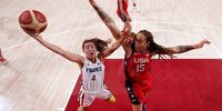 SAITAMA, JAPAN - AUGUST 02: Marine Fauthoux #4 of Team France goes up for a shot against Brittney Griner #15 of Team United States during the first half of a Women's Basketball Preliminary Round Group B game on day ten of the Tokyo 2020 Olympic Games at Saitama Super Arena on August 02, 2021 in Saitama, Japan. (Photo by Charlie Neibergall - Pool/Getty Images)