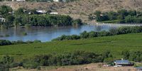 A view of the Keimoes area in the Northern Cape with the Orange River in flood running through agricultural land and the Ikaia River Lodge from Tierberg on 26 February, 2023. (Photo: David Harrison)
