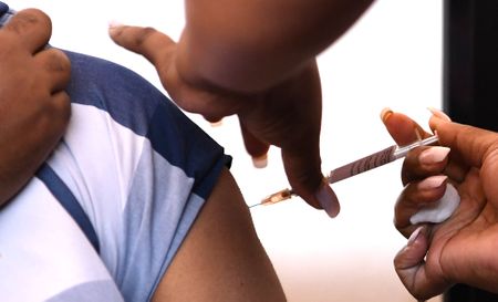 North Dakota, Manitoba form trucker vaccine pact; South Africa registers 853 new cases