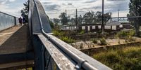 Schoolchildren cross a pedestrian bridge at Kliptown station. (Photo: Shiraaz Mohamed)