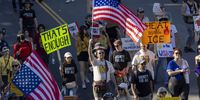 'No Kings protesters march in Los Angeles, California on 18 October. (Photo: Jill Connelly / EPA)
