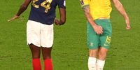 epa10321327 Ibrahima Konate (L) of France in action against Mitchell Duke of Australia during the FIFA World Cup 2022 group D soccer match between France and Australia at Al Janoub Stadium in Al Wakrah, Qatar, 22 November 2022.  EPA-EFE/Tolga Bozoglu