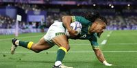 Selvyn Davids #8 of Team South Africa scores a try during the Men's Rugby Sevens Pool A Group match between New Zealand and South Africa on Day -2 of the Olympic Games Paris 2024 at Stade de France on July 24, 2024 in Paris, France. The Stade de France, originally built for the 1998 World Cup, will host many of the 2024 Paris Games’ track and field events. (Photo by Hannah Peters/Getty Images)