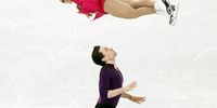 epa09726795 Michael Marinaro (bottom) and Kirsten Moore-Towers (top) of Canada in action during the Pair Skating - Short Program of the Figure Skating Team Event at the Beijing 2022 Olympic Games, Beijing, China, 04 February 2022.  EPA-EFE/HOW HWEE YOUNG