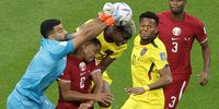 epa10316236 Goalkeeper Saad Al-Sheeb (L) of Qatar in action against Felix Torres (C) of Ecuador during the FIFA World Cup 2022 group A Opening Match between Qatar and Ecuador at Al Bayt Stadium in Al Khor, Qatar, 20 November 2022.  EPA-EFE/Ronald Wittek
