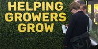 An exhibitor stand advertises "Helping Growers Grow" at the Mary Jane Berlin cannabis and hemp trade fair on June 14, 2024 in Berlin, Germany. Germany legalized cannabis consumption earlier this year. Cannabis production by local cannabis clubs will become legal in July. (Photo by Sean Gallup/Getty Images)