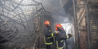  Firefighters examine the remains of a damaged shop following a fire at the Mohammadpur Krishi Market in Dhaka, Bangladesh, 14 September 2023. It took combined efforts of 17 Fire Service units supported by personnel from the Rapid Action Battalion (RAB) and Border Guard Bangladesh (BGB) for about six hours to bring the flames under control. The reason behind the fire was yet to be determined and no immediate casualties were reported.  EPA-EFE/MONIRUL ALAM