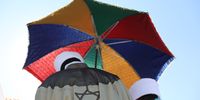 Ethiopian Jewish clergymen hold umbrellas as they pray during the 'Sigd' holiday in Jerusalem, Israel, 04 November 2021. The prayer is performed by Ethiopian Jews every year to celebrate the biblical union between the Jewish people and God.  EPA-EFE/ABIR SULTAN