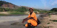 Adopt a River team member Teboho Kikine inspects sewage scum along the banks of the Umgeni River. (Photo: Tony Carnie)