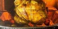 The rotisserie chicken roasting in an air fryer. (Photo: Tony Jackman)