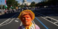 A protestor wears a baby costume with a mask of U.S. President Donald Trump during the second "No Kings" protest on October 18, 2025 in Washington, DC. Organizers expect millions to participate in cities and towns across the nation for the second "No Kings" protest to denounce the Trump administration. (Photo: Nathan Howard/Getty Images)