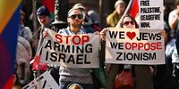 Protesters hold banners during a Pro-Palestine rally at the State Library of Victoria in Melbourne, Australia 21 July 2024.  EPA-EFE/MORGAN HANCOCK AUSTRALIA AND NEW ZEALAND OUT
