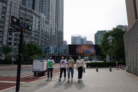 Covid-hit Beijing returns to work after subdued Labour Day break