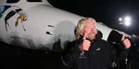 MOJAVE, CA - DECEMBER 7:  Sir Richard Branson gestures to reporters as Virgin Galactic unveils its new SpaceShipTwo spacecraft at the Mojave Spaceport on December 7, 2009 near Mojave, California. The eight-person VSS Enterprise, named after the Star Trek ship of the same name, is the first of a series of space-planes for customers of Virgin Galactic who have paid around $200,000 for a suborbital flight into space. British entrepreneur Sir Richard Branson is financing the spacecraft and aerospace designer Burt Rutan is building it through The Spaceship Company, a joint venture of Scaled Composites and Virgin Group.   (Photo by David McNew/Getty Images)