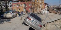 A car dangles from the edge of a partially-collapsed road in Hatay, Turkey, on Friday, Feb. 10, 2023. Turkish President Recep Tayyip Erdogan is facing mounting criticism from earthquake survivors and opposition parties over the countrys poor construction record and what they say has been an inadequate response to one of its worst natural disasters. Photographer: David Lombeida/Bloomberg via Getty Images