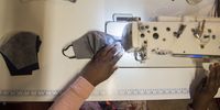 A view from above of Ponani Shikweni working on her sewing machine. The self-taught Shikweni provides training for her staff. (Photo: Shiraaz Mohamed)