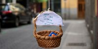 A basket with toys hangs from a balcony with a sign that says 'For those who want. Everything will be fine' on May 07, 2020 in Madrid, Spain. Spain is opening businesses such as hairdressers, delivery food restaurants and book shops after weeks of lockdown. Spain has had more than 256,000 confirmed cases of COVID-19 and over 26,000 reported deaths, although the rate has declined due to lockdown measures. (Photo by Carlos Alvarez/Getty Images)
