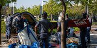 SAPS officers begin to dismantle climate activists’ camp outside Standard Bank offices after a three-day protest against the bank’s investment in fossil fuel projects.  (Photo: Julia Evans)