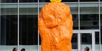 Ugo Rondinone’s 5 metre orange yellow hermit sculpture is displayed during a photocall for the Paddington Square's Art Programme at Paddington Square on July 18, 2024 in London, England. (Photo by John Phillips/Getty Images)