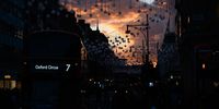 LONDON, ENGLAND - OCTOBER 25: Unlit Christmas decorations are seen suspended between lamp posts as shoppers walk through the retail district of Oxford Street on October 25, 2021 in London, England. Some toy retailers around the UK are worried that backlogs at the country's ports, as well as the HGV driver shortage, threaten their ability to keep high-demand items in stock this Christmas shopping season. (Photo by Leon Neal/Getty Images)