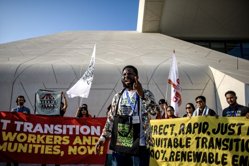 Activists protest against fossil fuel industry at COP28 climate summit
