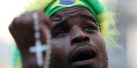 A Brazilian fan reacts during the public showing of the FIFA 2018 World Cup quarter final match between Brazil and Belgium in Rio de Janeiro, Brazil, 06 July 2018.  EPA-EFE/Marcelo Sayão