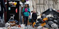 EDINBURGH, SCOTLAND - AUGUST 29: Members of the public walk past a large piles of rubbish on August 29, 2022 in Edinburgh, Scotland. Bin collections have been suspended in the Scottish capital for 10 days as waste workers have been on strike. Normal shifts will resume tomorrow here, but 13 more Scottish councils are scheduled to begin similar strike action on Wednesday. A second wave of waste-worker strikes in Edinburgh is scheduled from September 7-13, unless there's progress in talks between unions and local authorities. (Photo by Jeff J Mitchell/Getty Images)