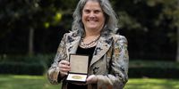 Andrea Ghez holds up her medal during a ceremony presenting her with the Nobel Prize in Physics in Beverly Hills, California, USA, 09 December 2020.  EPA-EFE/MARCIO JOSE SANCHEZ / POOL
