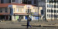 A man walks along a nearly-deserted street in Harare, Zimbabwe, 30 March 2020. The African country entered the first day of a 21-day nationwide lockdown decreed by President Emmerson Mnangagwa in a bid to slow down the spread of the pandemic COVID-19 disease caused by the SARS-CoV-2 coronavirus, which has so far resulted in one death in Zimbabwe. (Photo: EPA-EFE/AARON UFUMELI)