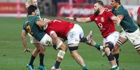 Damian de Allende (L) of South Africa is tackled by Tom Curry (C) of the BI Lions during the second rugby test match between South Africa and the British and Irish Lions at the Cape Town Stadium in Cape Town, South Africa, 31 July 2021. The Springboks play the British and Irish Lions in a 3 match series.  EPA-EFE/BackpagePix