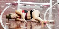epa09388543 Sara Slott Petersen of Denmark falls in the rain during the Women's 400m Hurdles Semifinals during the Athletics events of the Tokyo 2020 Olympic Games at the Olympic Stadium in Tokyo, Japan, 02 August 2021.  EPA-EFE/FRANCK ROBICHON