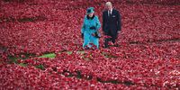 epa09123961 (FILE) - A picture dated 16 October 2014 shows Britain's Queen Elizabeth II (L) and Prince Philip, Duke of Edinburgh, (R) walking among ceramic red poppies planted in memory of the British and Commonwealth dead from WWI in the moat at the Tower of London, in London, Britain  (reissued 09 April 2021. According to the Buckingham Palace, Prince Philip has died aged 99.  EPA-EFE/ANDY RAIN
