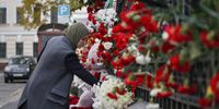 A woman lays flowers in memory of the victims in Palestine near the Palestinian embassy in Moscow, Russia, 17 October 2023. Thousands of Israelis and Palestinians have died since the militant group Hamas launched an unprecedented attack on Israel from the Gaza Strip on 07 October 2023, leading to Israeli retaliation strikes on the Palestinian enclave.  EPA-EFE/YURI KOCHETKOV