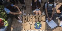 Young activists taking a much needed break outside the Department of Mineral Resources, Pretoria.<br>Photo / Shiraaz Mohamed.