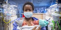 CAPE TOWN, SOUTH AFRICA - FEBRUARY 23:  Andiswa Mtwesi holds her twins at the Mowbray Maternity Hospital on February 23, 2022 in Cape Town, South Africa. The twins were born February 22, 2022 which is a palindrome day or a date that can be read the same way backward or forward. (Photo by Gallo Images/Die Burger/Jaco Marais)