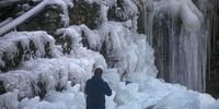 A Kashmiri man takes pictures of  parts frozen water on a stream in the Drang area of Tangmarg, north of Srinagar, the summer capital of Indian Kashmir, 14 December 2023. Cold wave has gripped Kashmir over the past two weeks and Srinagar recorded the coldest night of the season, plunging to a bone-chilling minus 5.4 degrees Celsius on Thursday and leading to the partially freezing of water bodies. The local Meteorological forecast suggests that the ongoing cold wave will continue, with nighttime temperatures anticipated to drop even more and foggy conditions persisting until 22 December.  EPA-EFE/FAROOQ KHAN